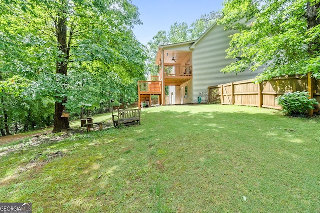 view of yard with a deck and stairway