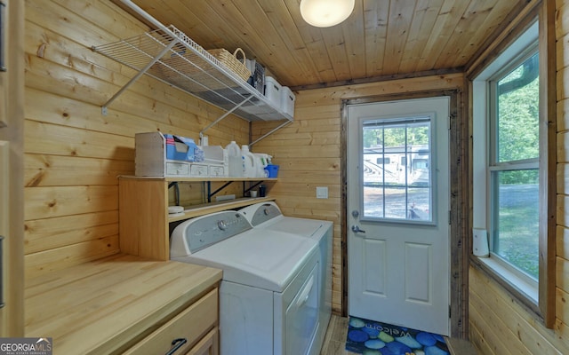 laundry room with separate washer and dryer, wood walls, and wood ceiling