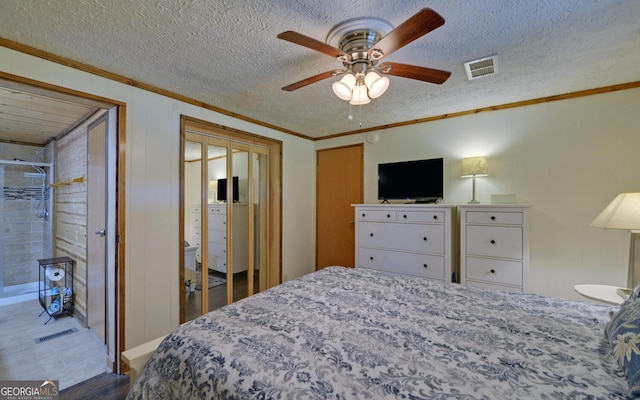 bedroom with crown molding, a ceiling fan, and a textured ceiling