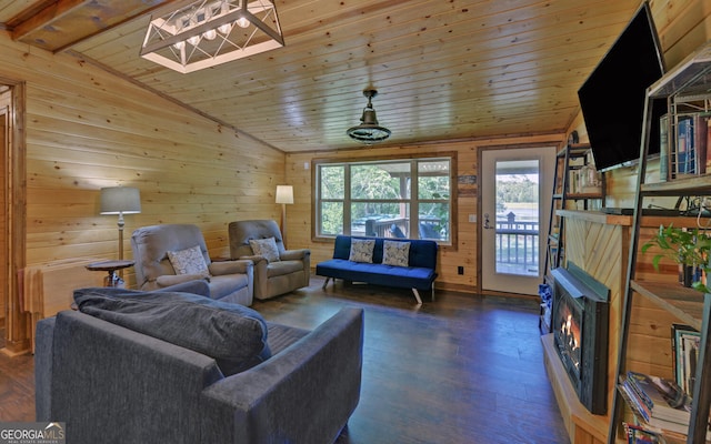 living area with vaulted ceiling, wood ceiling, wood walls, and dark wood-style flooring