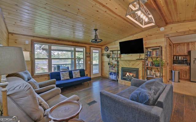 living room featuring wood walls, vaulted ceiling, wooden ceiling, hardwood / wood-style flooring, and a high end fireplace