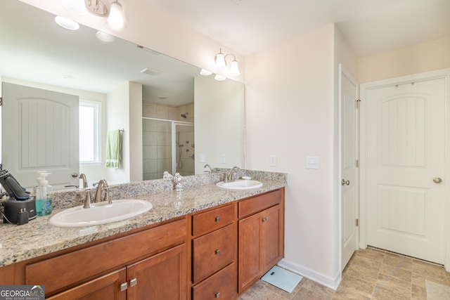 7155 Pine Seed Dr, Midland, GA 31820 - bathroom with a stall shower, double vanity, and baseboards