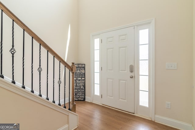 7155 Pine Seed Dr, Midland, GA 31820 - foyer featuring wood finished floors, baseboards, and stairs