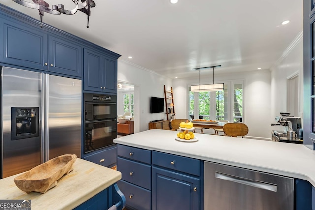 130 River Lndg NE, Sandy Springs, GA 30350 - kitchen with appliances with stainless steel finishes, blue cabinets, crown molding, healthy amount of natural light, and light countertops