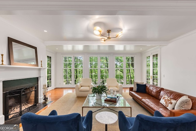 130 River Lndg NE, Sandy Springs, GA 30350 - living room featuring crown molding, a fireplace with flush hearth, wood finished floors, and recessed lighting