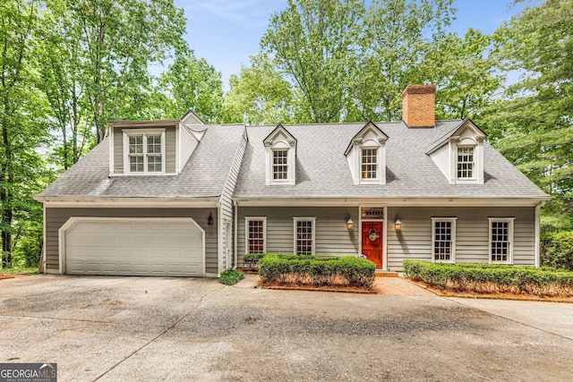 130 River Lndg NE, Sandy Springs, GA 30350 - cape cod-style house featuring driveway, a chimney, a garage, roof with shingles, and covered porch
