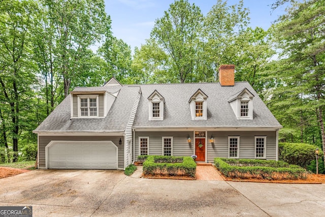 130 River Lndg NE, Sandy Springs, GA 30350 - cape cod-style house featuring concrete driveway, an attached garage, a chimney, and a shingled roof