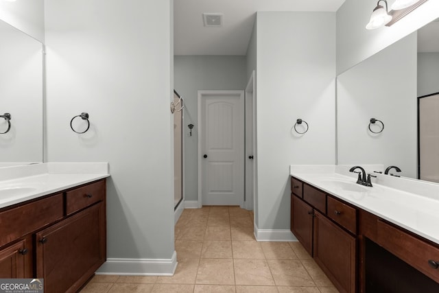 4633 Hidden Creek Dr, Gainesville, GA 30504 - bathroom featuring baseboards, two vanities, tile patterned flooring, and a shower stall
