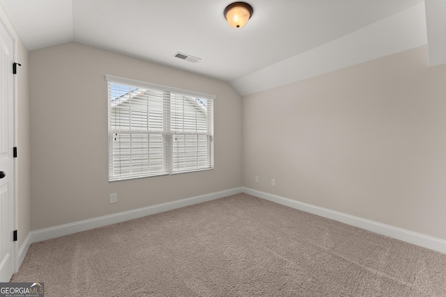 4633 Hidden Creek Dr, Gainesville, GA 30504 - spare room featuring lofted ceiling, carpet, and baseboards