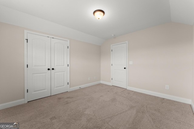 4633 Hidden Creek Dr, Gainesville, GA 30504 - unfurnished bedroom with vaulted ceiling, carpet floors, baseboards, and a closet