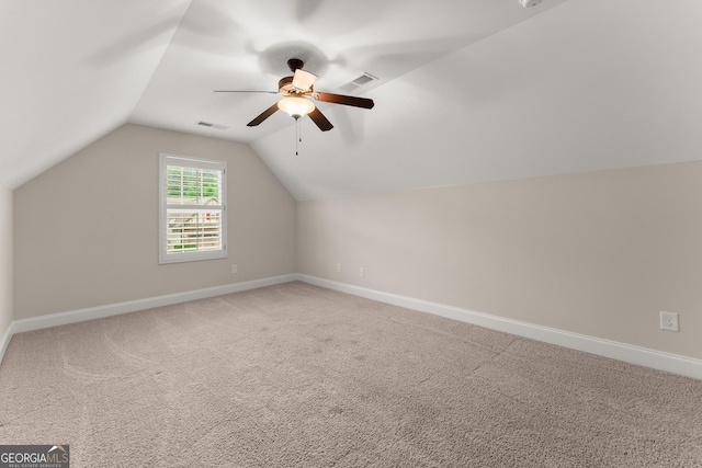 4633 Hidden Creek Dr, Gainesville, GA 30504 - additional living space with light carpet, a ceiling fan, baseboards, and vaulted ceiling
