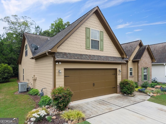 4633 Hidden Creek Dr, Gainesville, GA 30504 - craftsman-style home with central air condition unit, driveway, a garage, a front yard, and roof with shingles