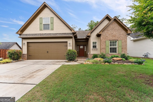 4633 Hidden Creek Dr, Gainesville, GA 30504 - craftsman-style home with brick siding, a front lawn, concrete driveway, and an attached garage