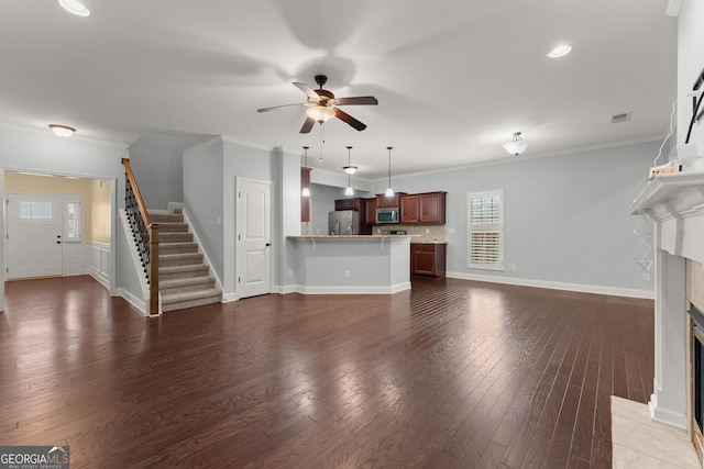 4633 Hidden Creek Dr, Gainesville, GA 30504 - unfurnished living room with stairway, a fireplace with flush hearth, a ceiling fan, wood finished floors, and crown molding