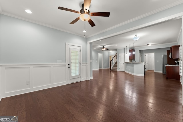 4633 Hidden Creek Dr, Gainesville, GA 30504 - unfurnished living room with a ceiling fan, stairs, recessed lighting, wainscoting, and crown molding