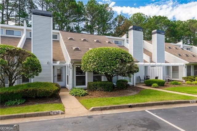 1630 Homestead Trl, Alpharetta, GA 30004 - view of front of home with a chimney and uncovered parking