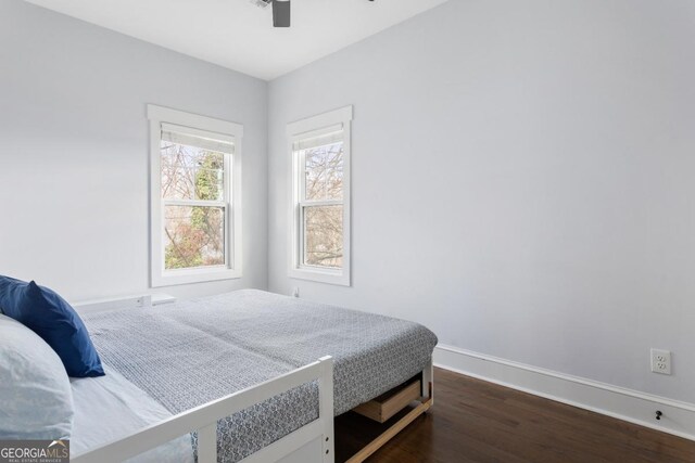 569 Hope St SW, Atlanta, GA 30310 - bedroom featuring baseboards, dark wood-style flooring, and ceiling fan