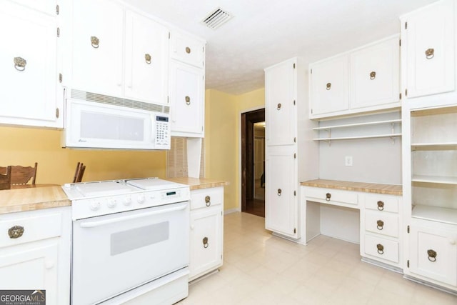 2228 Walker Dr, Lawrenceville, GA 30043 - kitchen featuring white appliances, white cabinets, and light countertops