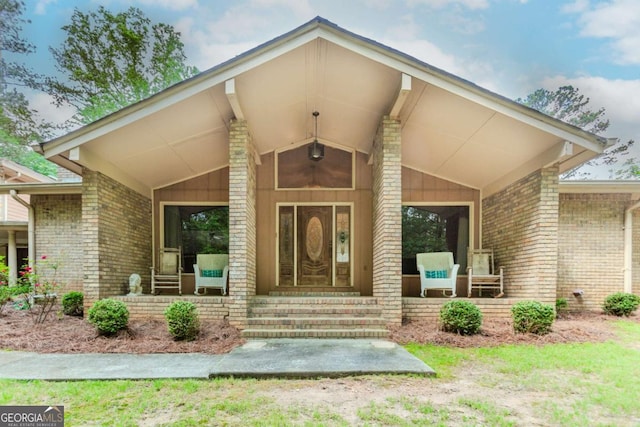 2228 Walker Dr, Lawrenceville, GA 30043 - doorway to property with brick siding and a porch