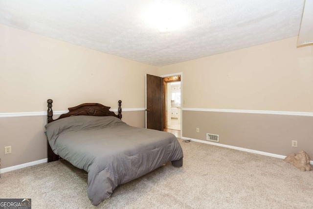 2228 Walker Dr, Lawrenceville, GA 30043 - carpeted bedroom featuring baseboards and a textured ceiling