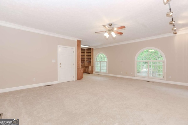 2228 Walker Dr, Lawrenceville, GA 30043 - empty room featuring a ceiling fan, crown molding, light carpet, and baseboards
