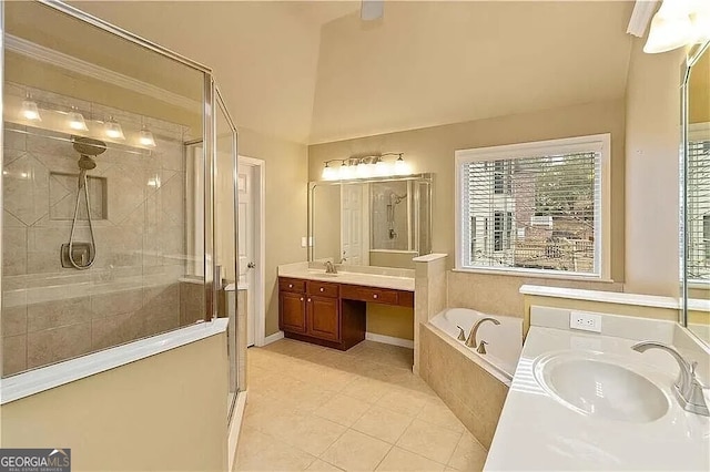 bathroom with a stall shower, a bath, vanity, tile patterned flooring, and healthy amount of natural light
