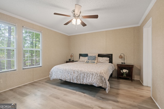 194 Phillips Dr, Eatonton, GA 31024 - bedroom featuring wood finished floors, crown molding, ceiling fan, and a textured ceiling
