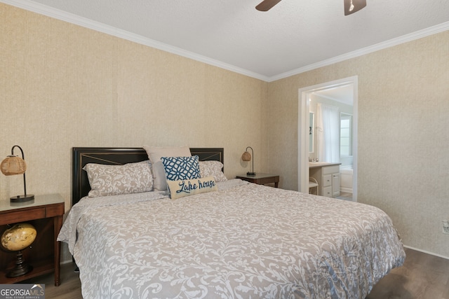 194 Phillips Dr, Eatonton, GA 31024 - bedroom with wood finished floors, ornamental molding, ceiling fan, ensuite bathroom, and wallpapered walls