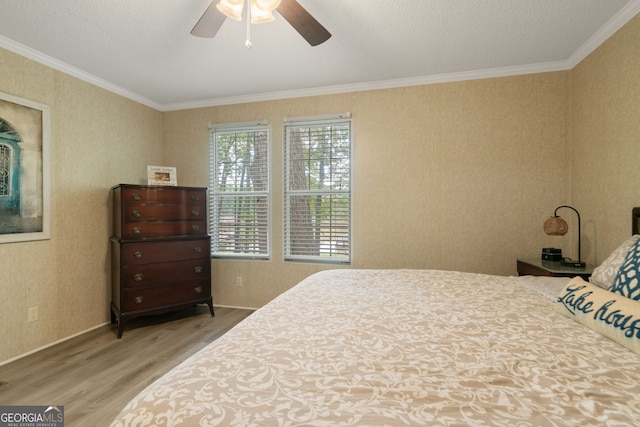194 Phillips Dr, Eatonton, GA 31024 - bedroom with wood finished floors, ornamental molding, and ceiling fan