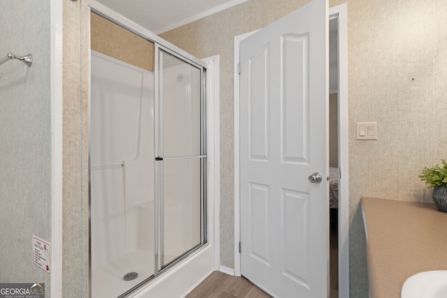 194 Phillips Dr, Eatonton, GA 31024 - full bathroom with a shower stall, wood finished floors, and crown molding