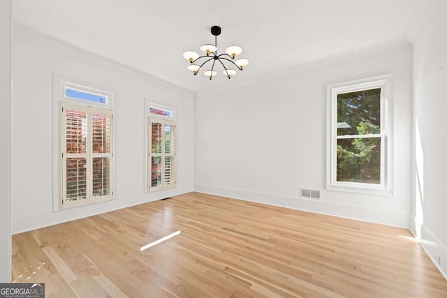 8745 Islesworth Ct, Duluth, GA 30097 - unfurnished dining area featuring a chandelier, crown molding, light wood-style floors, and baseboards