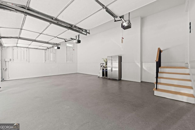 8745 Islesworth Ct, Duluth, GA 30097 - garage featuring a garage door opener and freestanding refrigerator