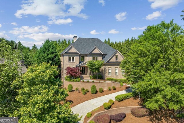 8745 Islesworth Ct, Duluth, GA 30097 - view of front of home featuring a chimney and brick siding