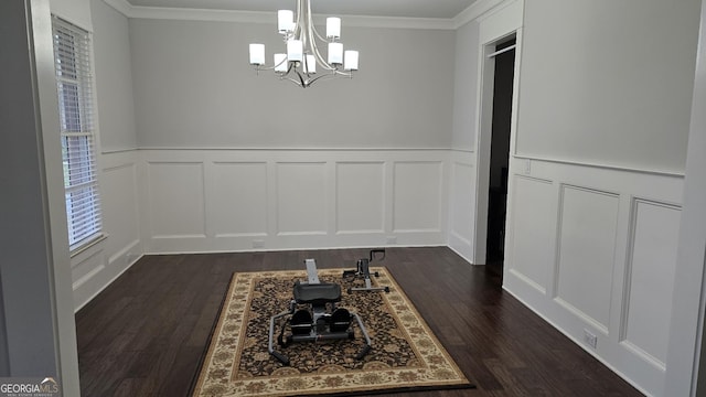 605 Lanshire Dr, Alpharetta, GA 30004 - unfurnished dining area with a decorative wall, a chandelier, dark wood-style flooring, ornamental molding, and wainscoting