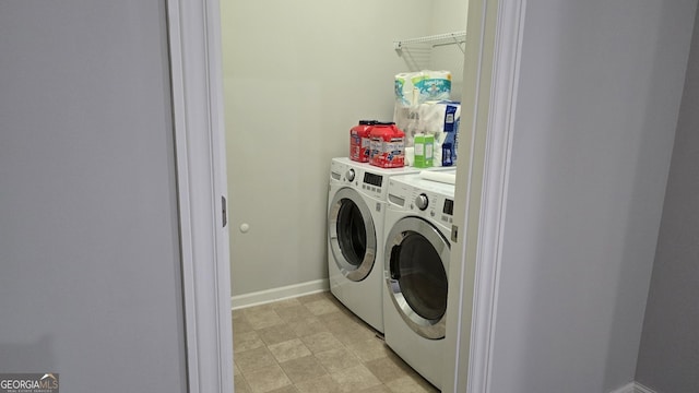 605 Lanshire Dr, Alpharetta, GA 30004 - laundry area with washing machine and clothes dryer and baseboards