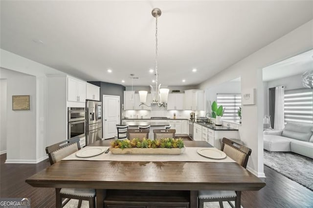 130 W Pier Way, Fayetteville, GA 30214 - dining area with dark wood-style floors, baseboards, a chandelier, and recessed lighting
