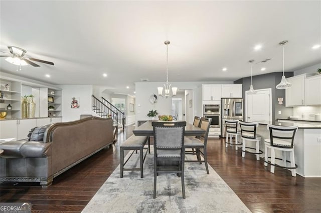 130 W Pier Way, Fayetteville, GA 30214 - dining room with dark wood-type flooring, a ceiling fan, recessed lighting, a chandelier, and stairs
