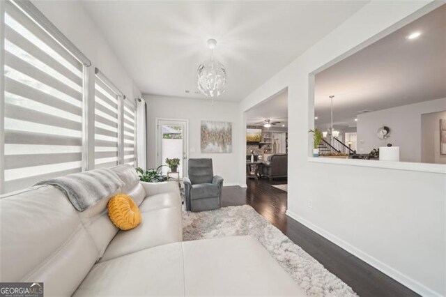 130 W Pier Way, Fayetteville, GA 30214 - living room with a chandelier, dark wood finished floors, and stairway