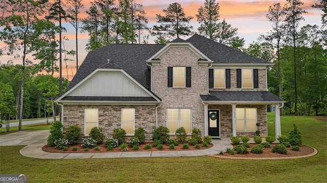 130 W Pier Way, Fayetteville, GA 30214 - craftsman-style home with board and batten siding, a front lawn, a shingled roof, and stone siding