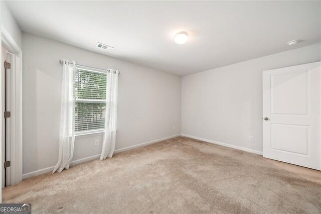 130 W Pier Way, Fayetteville, GA 30214 - spare room featuring carpet floors and a smoke detector