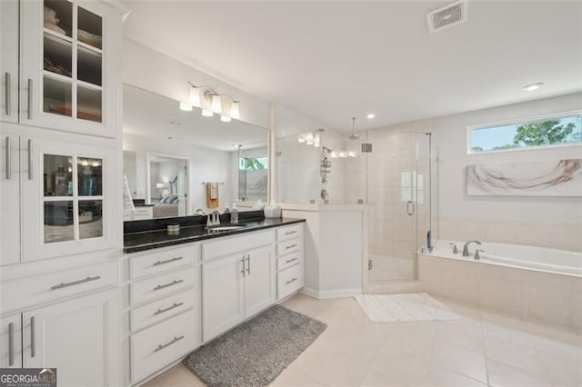 130 W Pier Way, Fayetteville, GA 30214 - ensuite bathroom featuring a shower stall, a bath, vanity, and tile patterned flooring