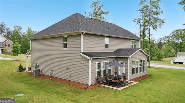 130 W Pier Way, Fayetteville, GA 30214 - back of property featuring a yard, a patio, roof with shingles, and central AC unit