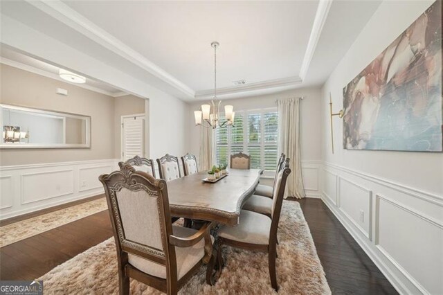 130 W Pier Way, Fayetteville, GA 30214 - dining room featuring a raised ceiling, a chandelier, dark wood finished floors, a decorative wall, and a wainscoted wall