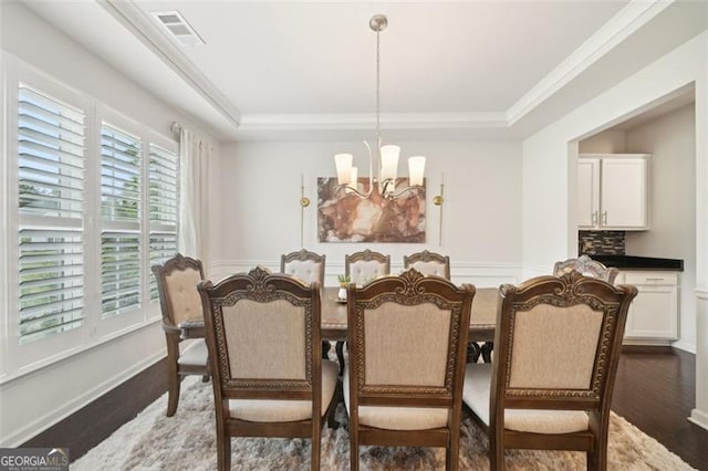 130 W Pier Way, Fayetteville, GA 30214 - dining area with a chandelier, wood finished floors, a raised ceiling, and ornamental molding