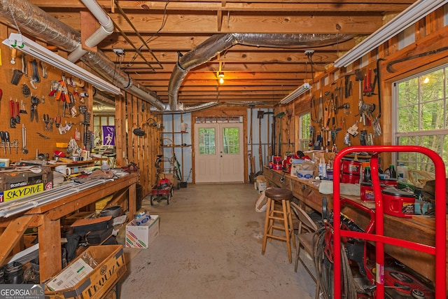below grade area with a workshop area and healthy amount of natural light