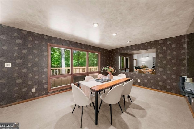 dining space featuring baseboards, carpet, wallpapered walls, and recessed lighting