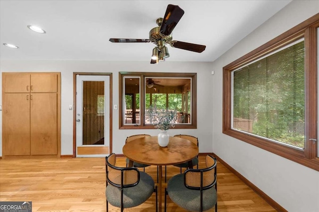 dining area featuring baseboards, light wood-style floors, a ceiling fan, and recessed lighting