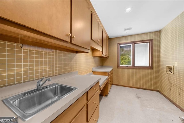 laundry area featuring cabinet space, hookup for a washing machine, and light colored carpet