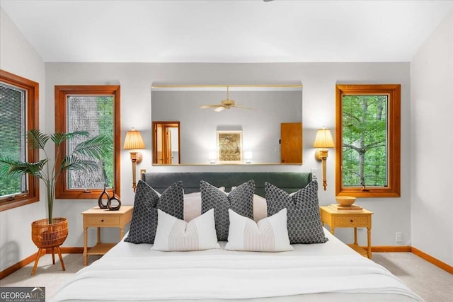 carpeted bedroom featuring baseboards