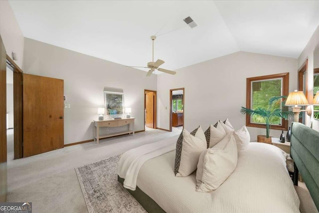 bedroom with light colored carpet, vaulted ceiling, ceiling fan, and baseboards